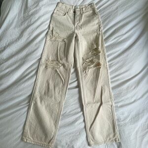 Cream ripped jeans from urban outfitters in size 26
